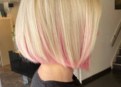 Blonde bob hairstyle with pastel pink highlights at Amy Curran Hair and Makeup, Altrincham, England, GB.