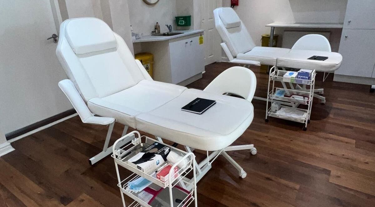 Treatment chairs and equipment at Amy Curran Lip Blush, Sale, England, GB, showcasing a serene setup.