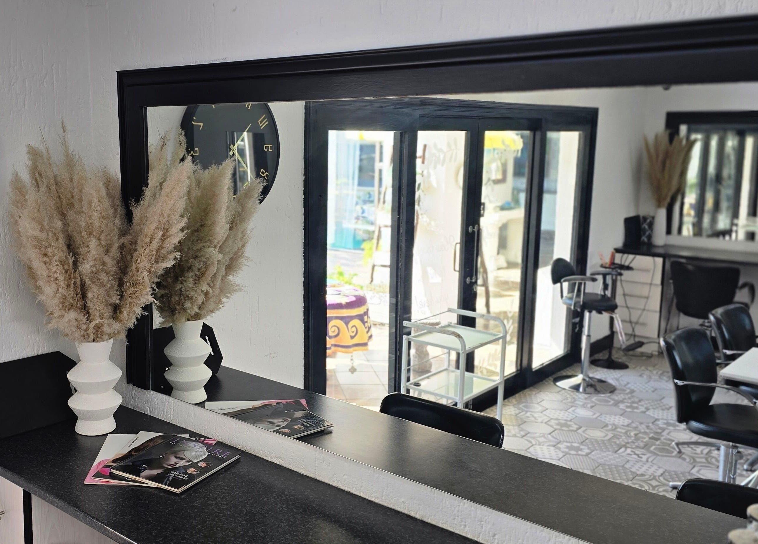 Stylish interior of Hair On View, Boksburg, Gauteng, ZA with modern decor and large mirrors.