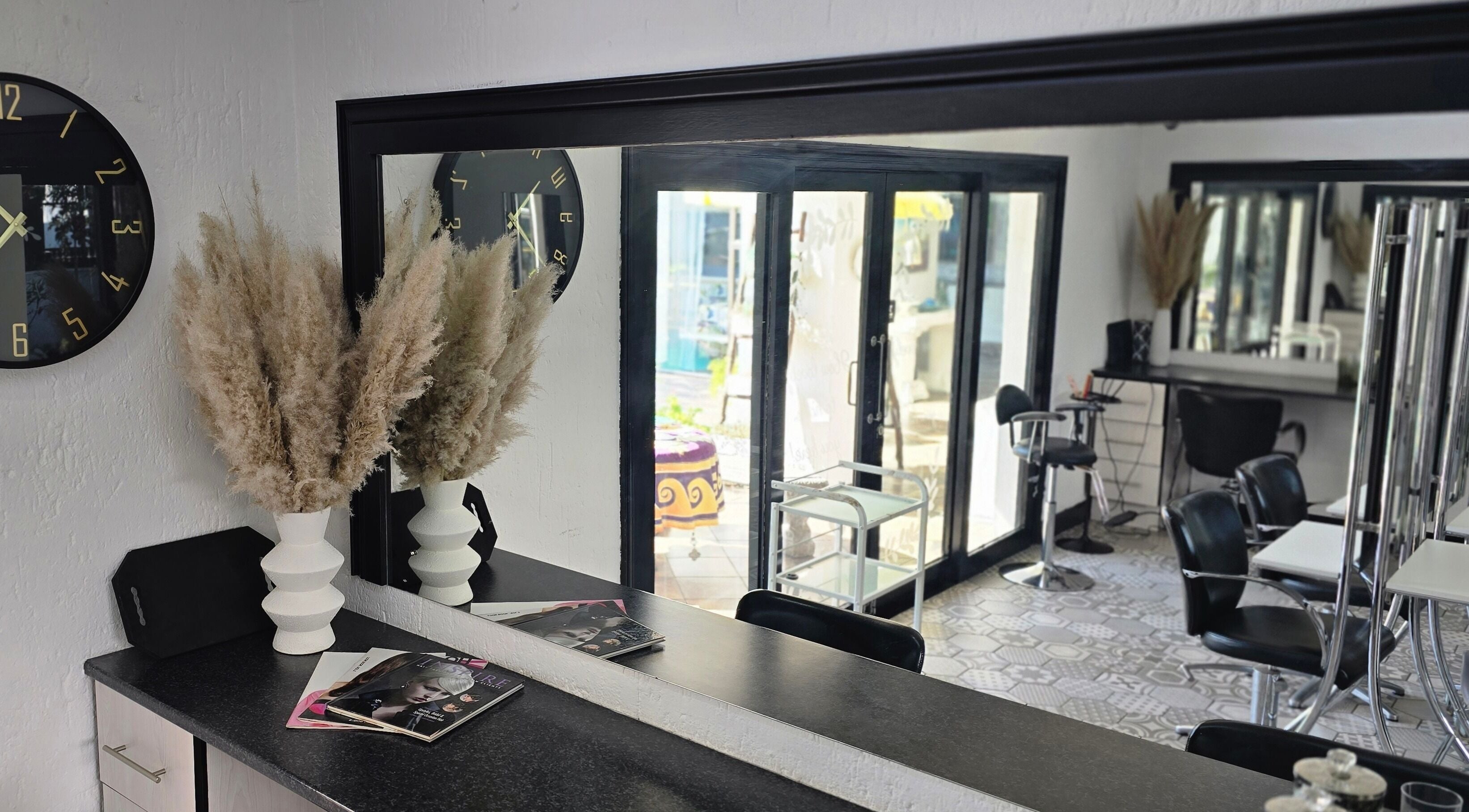 Stylish interior of Hair On View, Boksburg, Gauteng, ZA with modern decor and large mirrors.