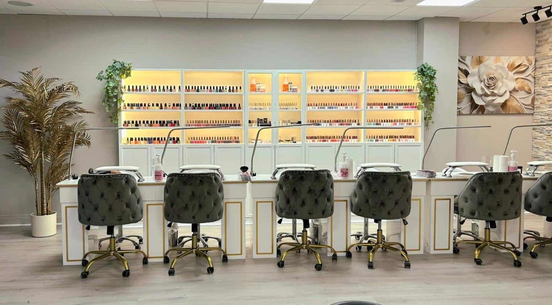 Modern nail station at Queen Hand & Foot Spa in Letterkenny, IE with plush chairs and nail polish display.