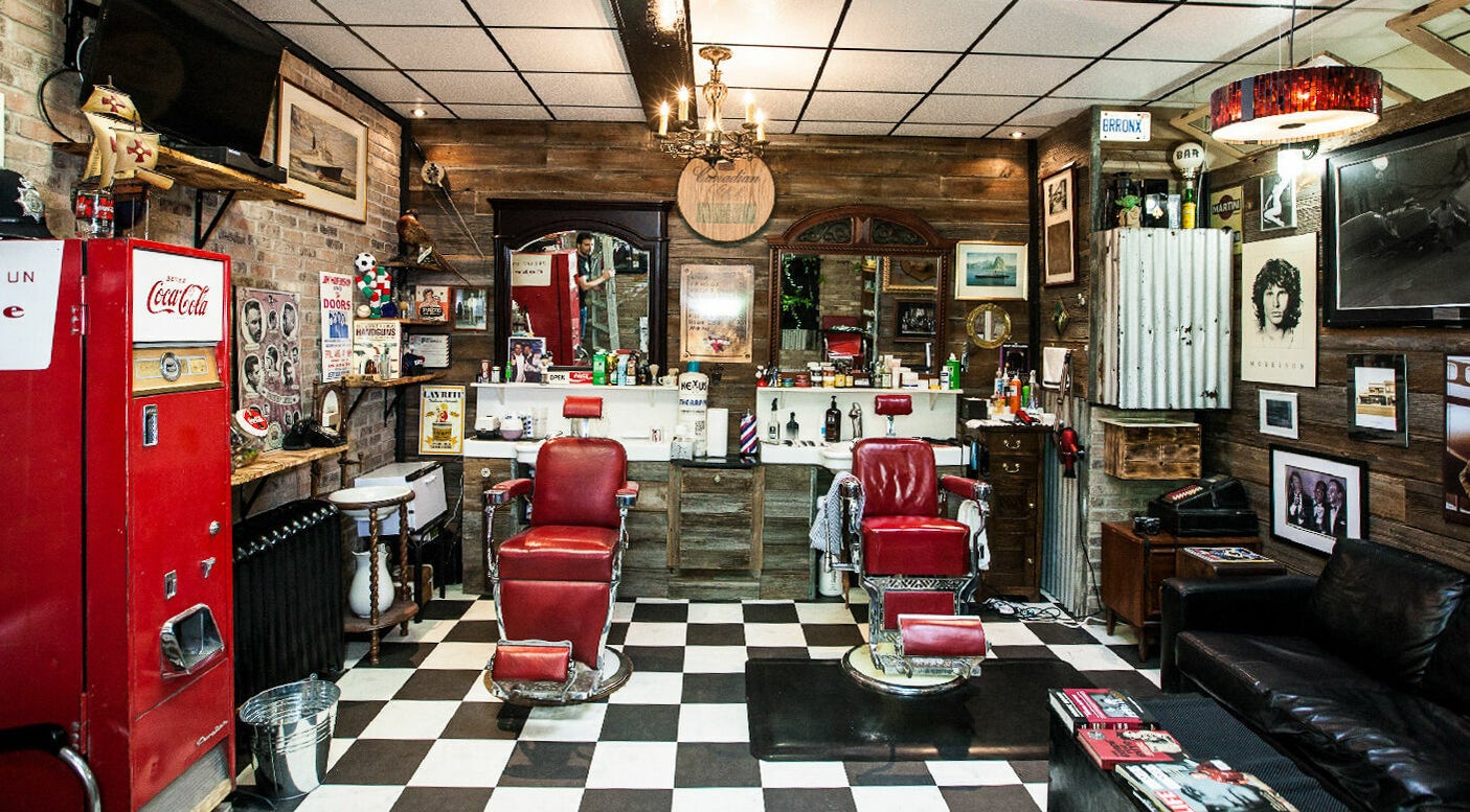 Interior of Back Alley Barbershop and Cigars in Niagara Falls, Ontario, CA with vintage barber chairs and decor.