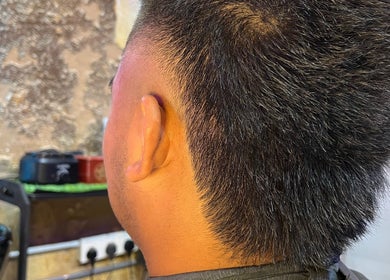 Close-up of a short haircut with a fade at Goblings barbershop in Melaka, Melaka, MY.