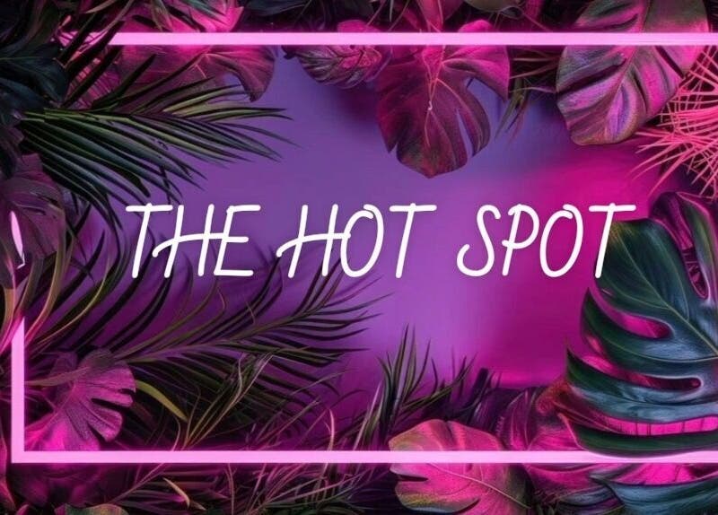 Vibrant tropical design at The Hot Spot, Blooming Grove, Texas, US. Neon lights and lush foliage create allure.