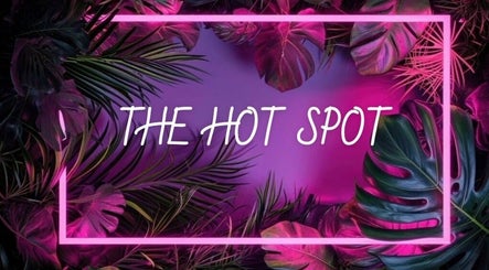 Vibrant tropical design at The Hot Spot, Blooming Grove, Texas, US. Neon lights and lush foliage create allure.