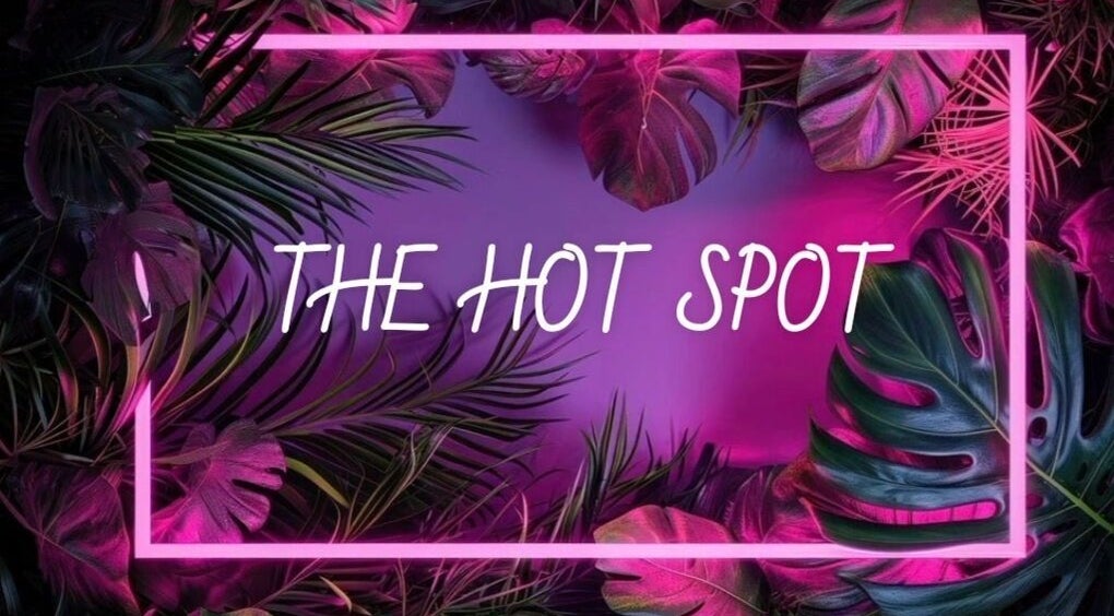 Vibrant tropical design at The Hot Spot, Blooming Grove, Texas, US. Neon lights and lush foliage create allure.