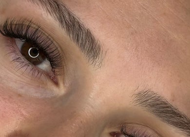 Close-up of expertly shaped brows and lashes at GlowBrows Phi, Vancouver, British Columbia, CA.