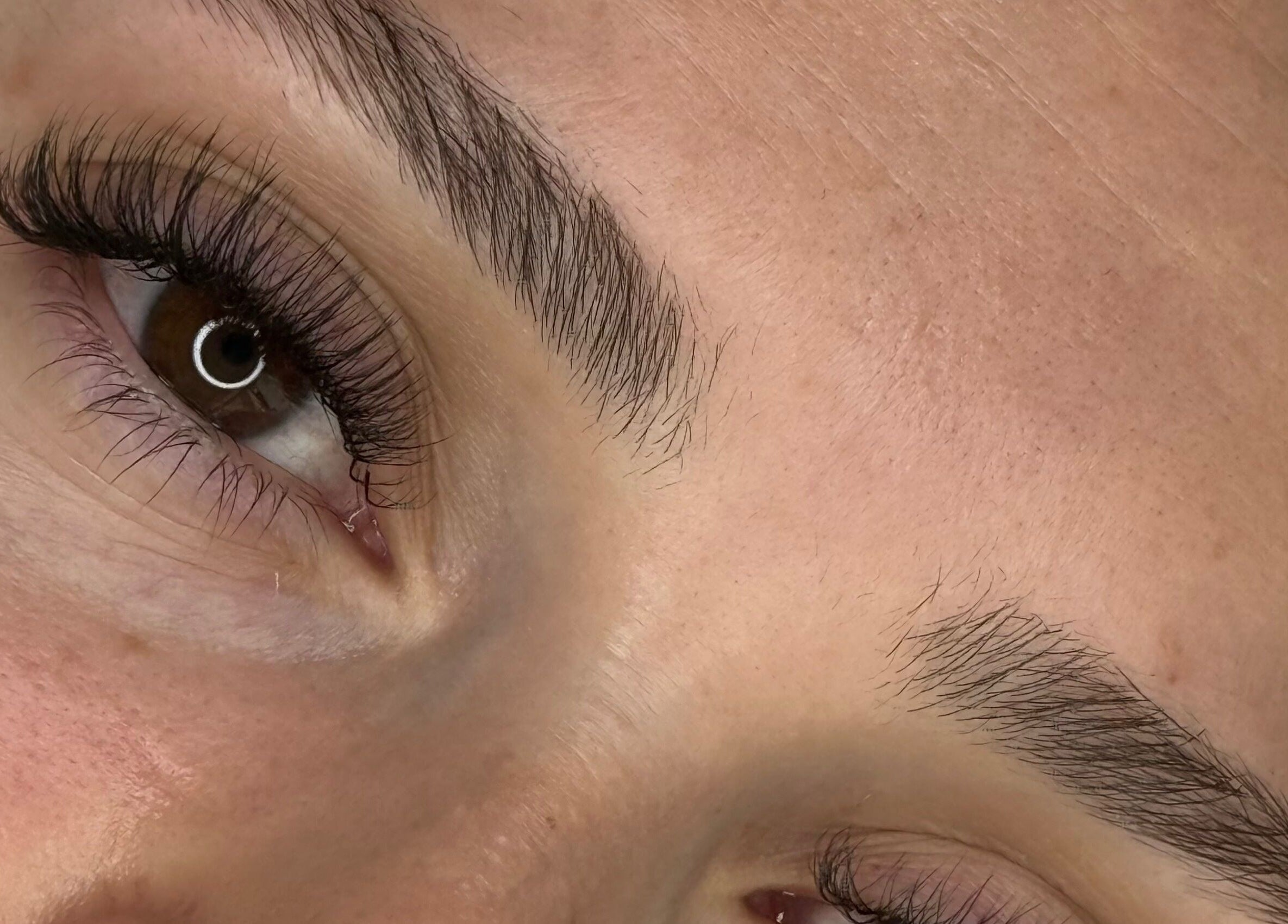 Close-up of expertly shaped brows and lashes at GlowBrows Phi, Vancouver, British Columbia, CA.