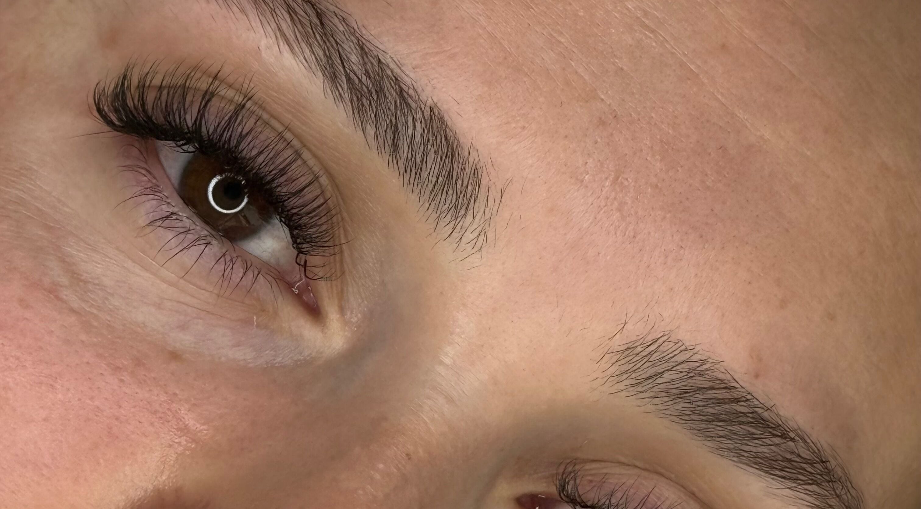 Close-up of expertly shaped brows and lashes at GlowBrows Phi, Vancouver, British Columbia, CA.