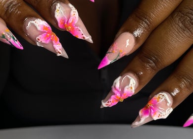 Floral nail art at CZR Nails, London, England, GB showcasing vibrant pink and white designs.