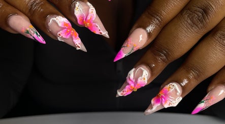 Floral nail art at CZR Nails, London, England, GB showcasing vibrant pink and white designs.