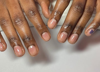 Freshly manicured nails at CZR Nails, London, England, GB, showcasing a glossy finish and unique design.