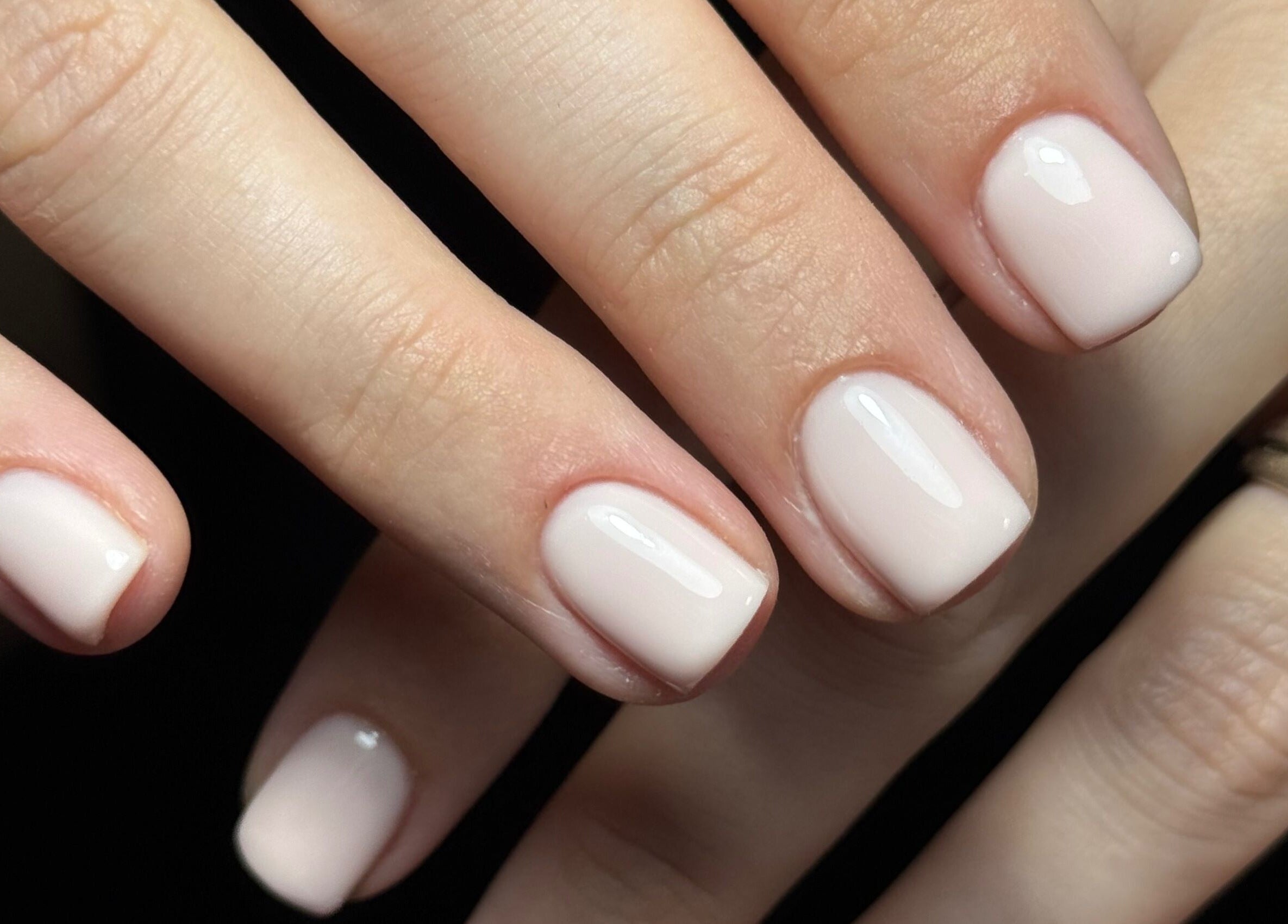 Beautifully manicured nails in light pink at Nails by Estee, Horsham, England, GB, showcasing elegant style.