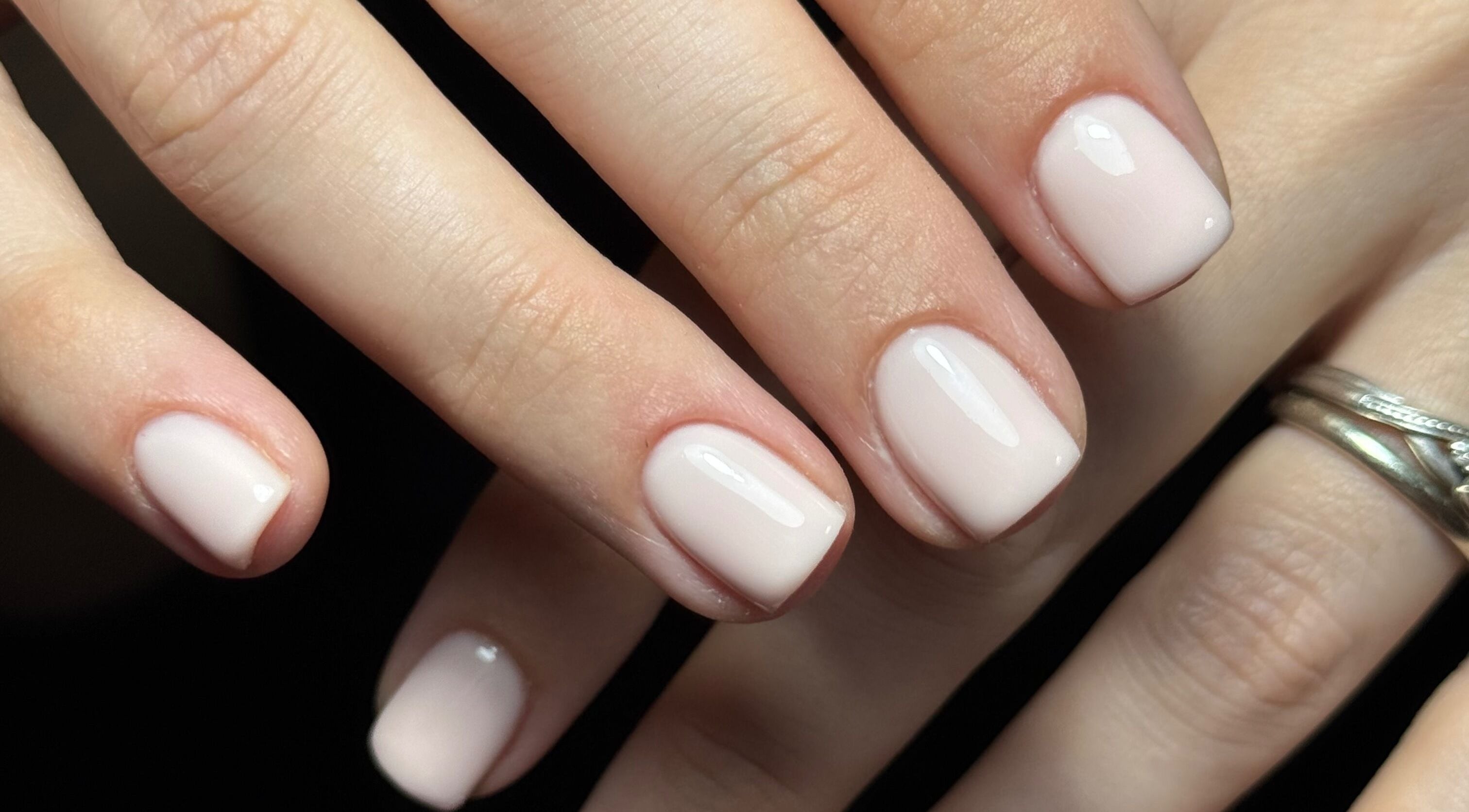 Beautifully manicured nails in light pink at Nails by Estee, Horsham, England, GB, showcasing elegant style.