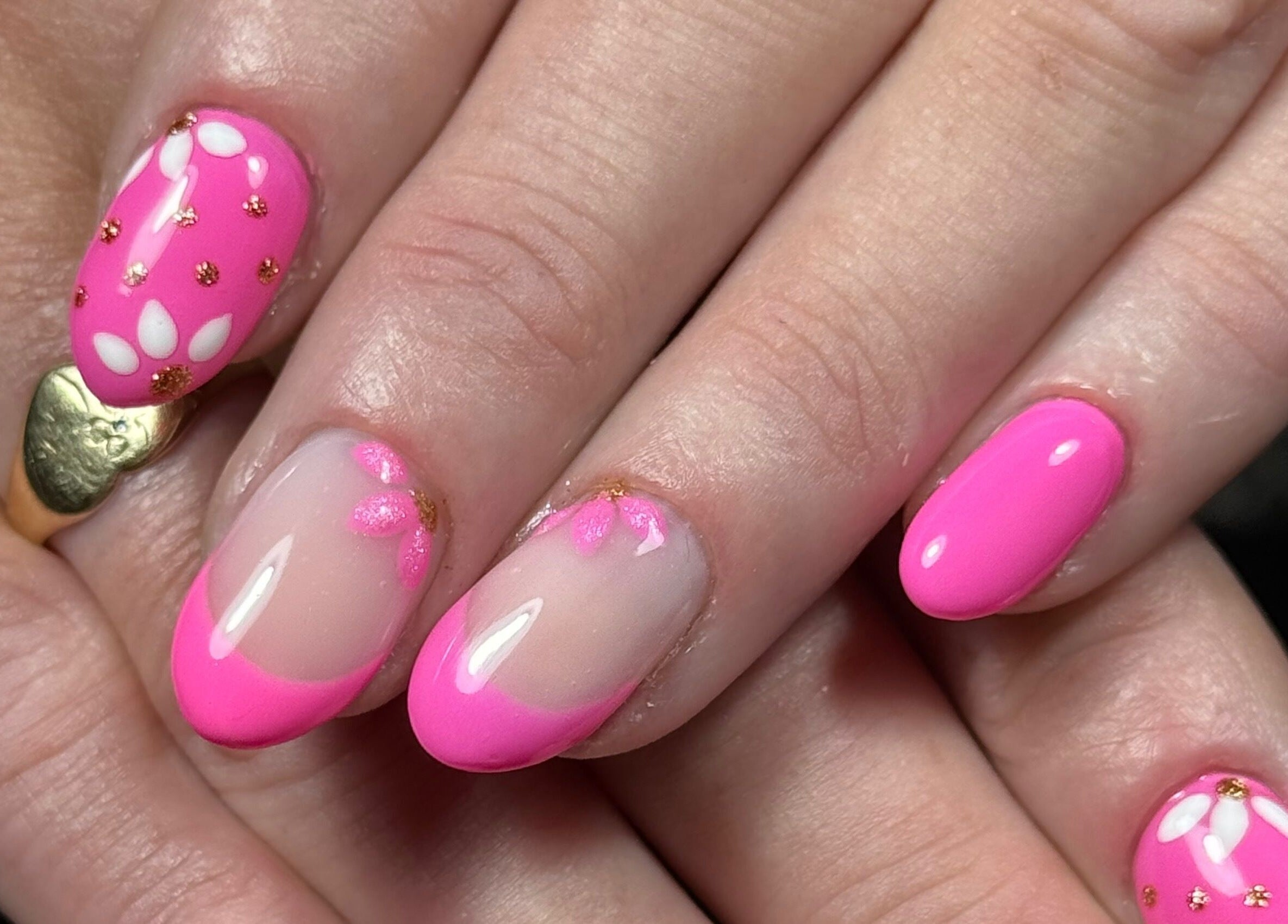 Floral pink nail art by Nails by Estee, Horsham, England, GB with gold accents.