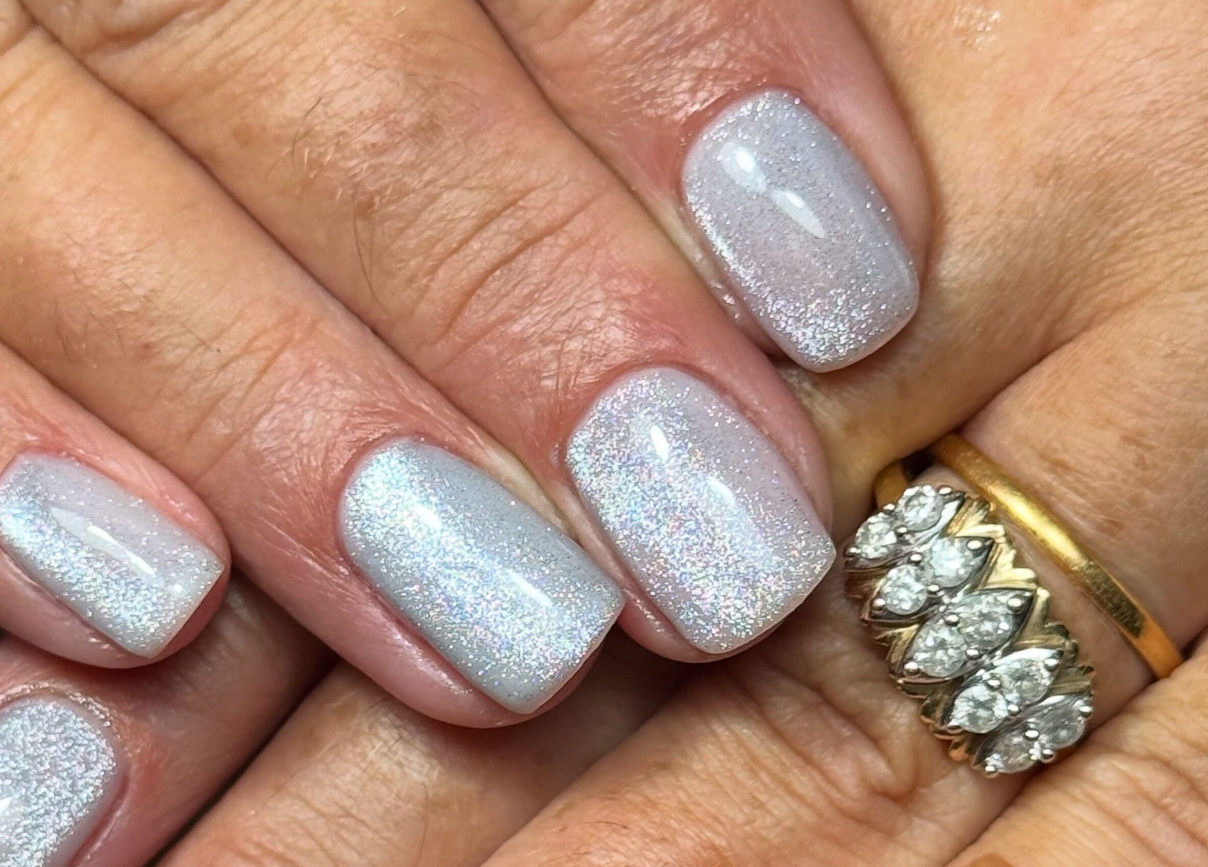 Sparkling silver manicure at Nails by Estee in Horsham, England, GB.