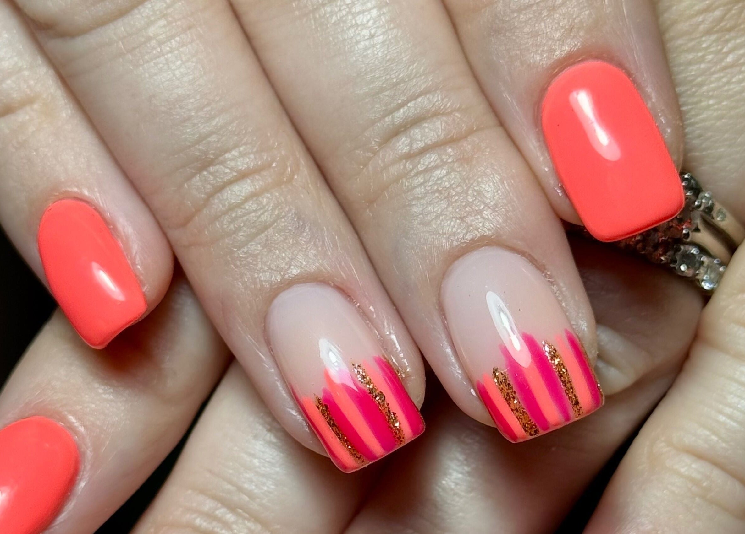Bold red and pink nail design at Nails by Estee, Horsham, England, GB. Stunning creativity and style.