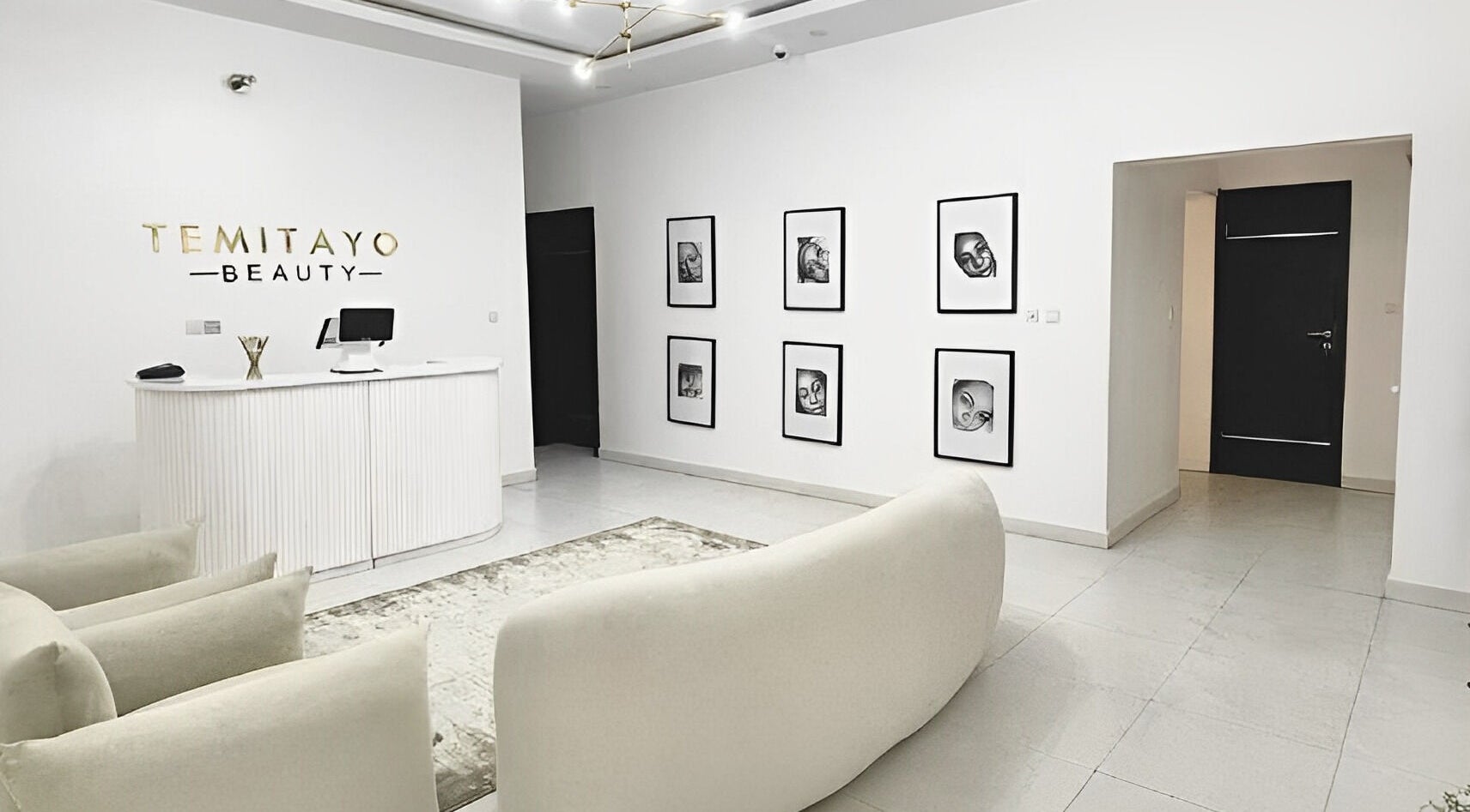 Reception area of Temitayo Beauty in Lekki, Lagos, NG featuring modern decor and soft seating.