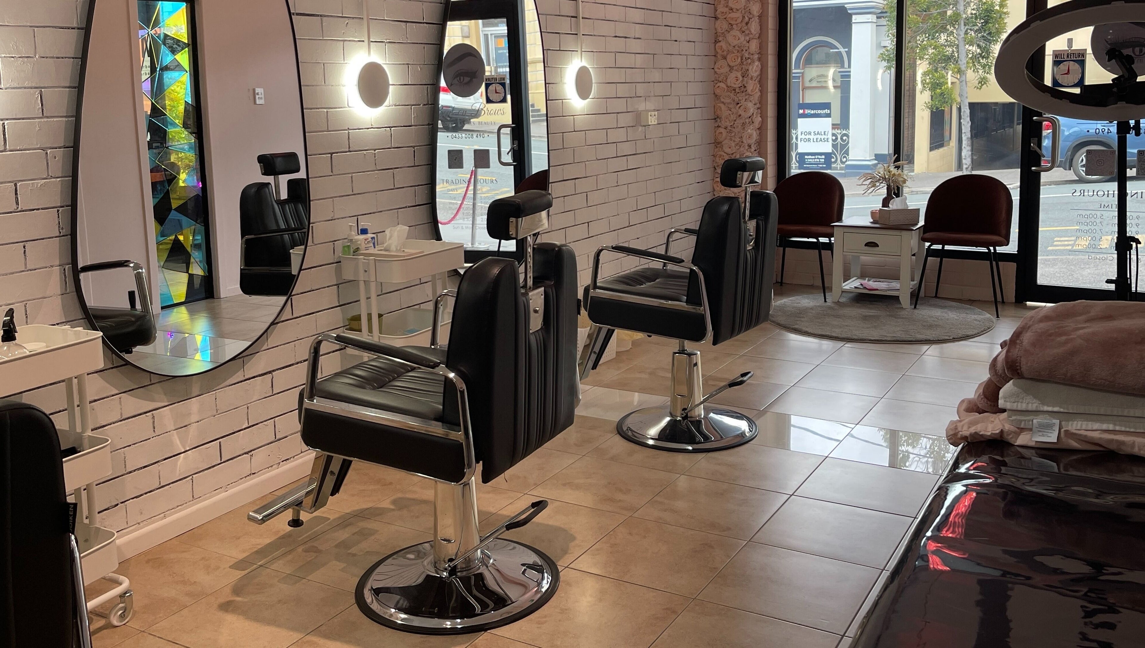 Modern salon interior at Bent On Brows in Gympie, Queensland. Stylish chairs and mirrors enhance the ambiance.