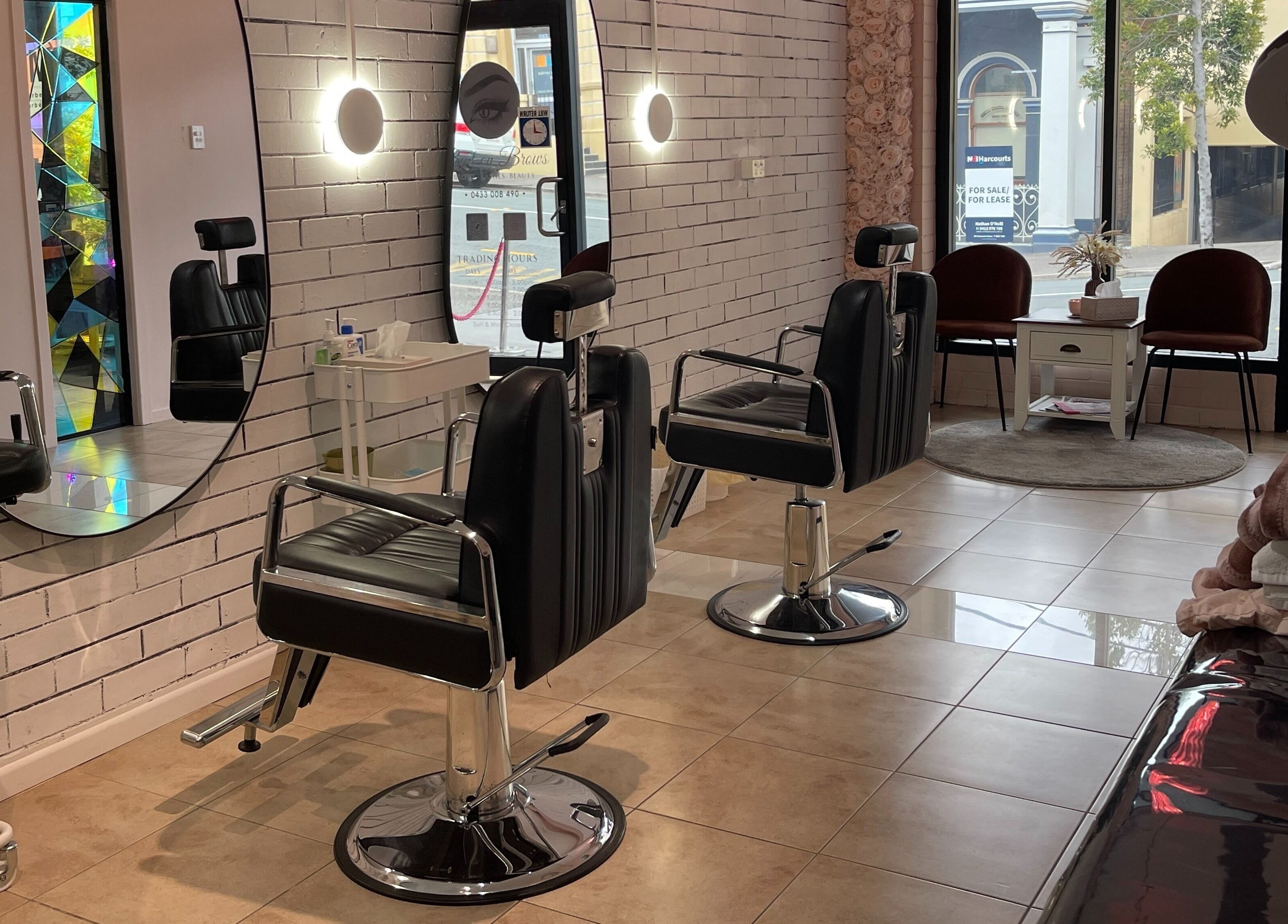 Modern salon interior at Bent On Brows in Gympie, Queensland. Stylish chairs and mirrors enhance the ambiance.