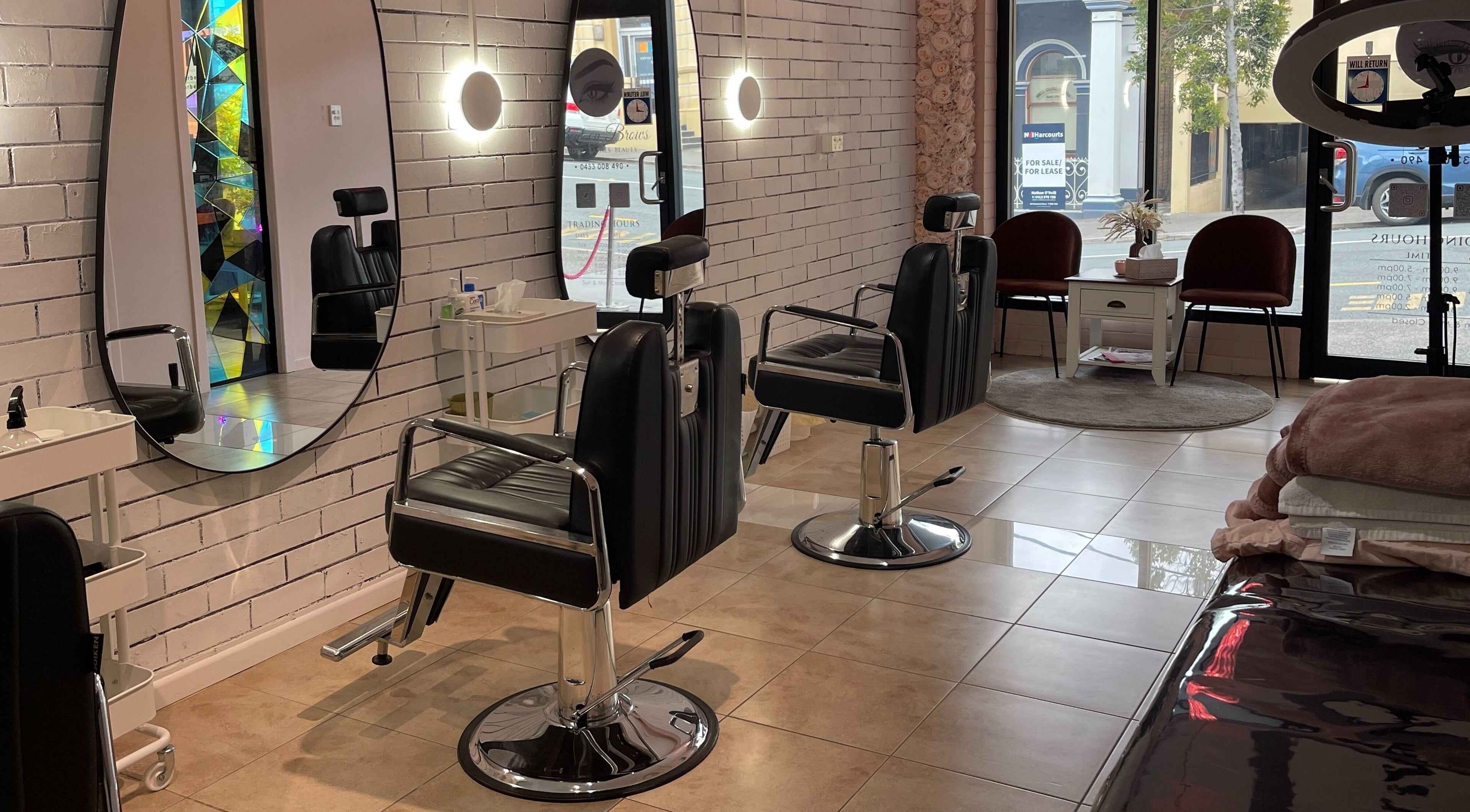 Modern salon interior at Bent On Brows in Gympie, Queensland. Stylish chairs and mirrors enhance the ambiance.