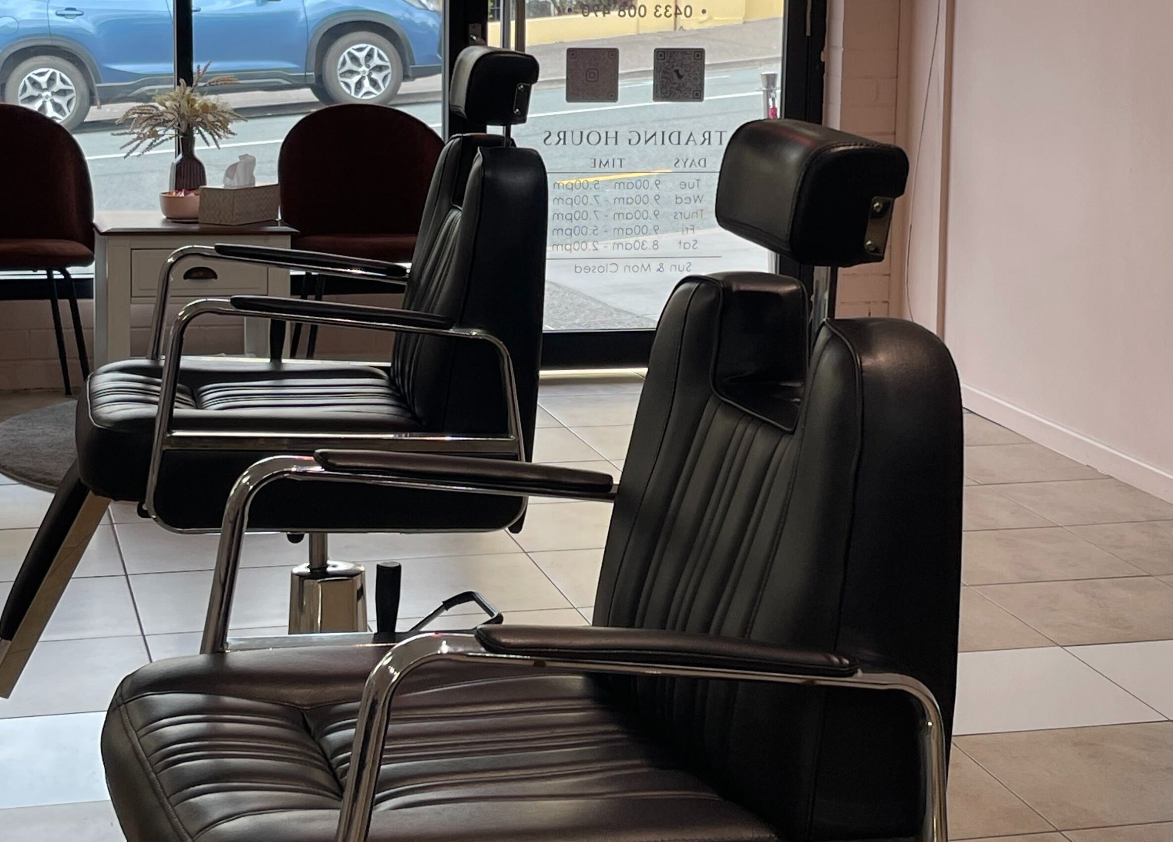 Sleek black chairs at Bent On Brows, Gympie, Queensland, AU, showcasing a modern and comfortable beauty setting.