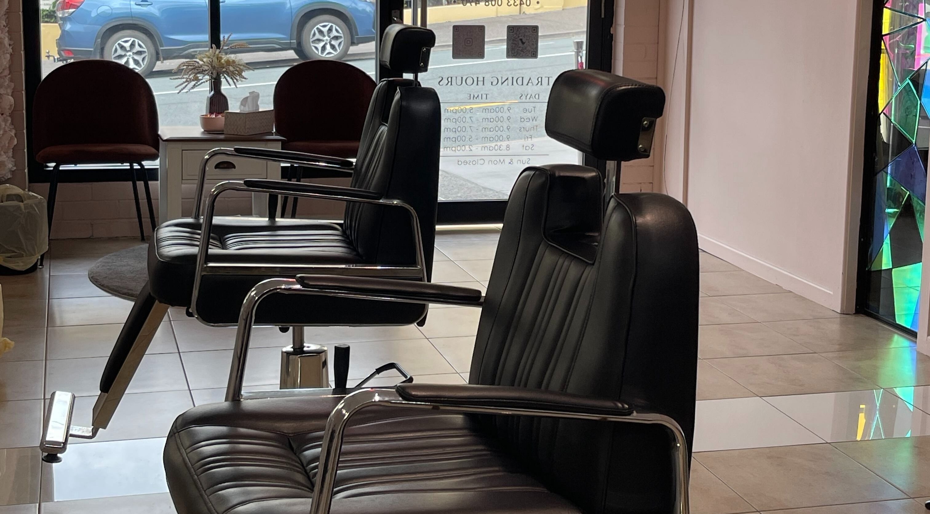 Sleek black chairs at Bent On Brows, Gympie, Queensland, AU, showcasing a modern and comfortable beauty setting.
