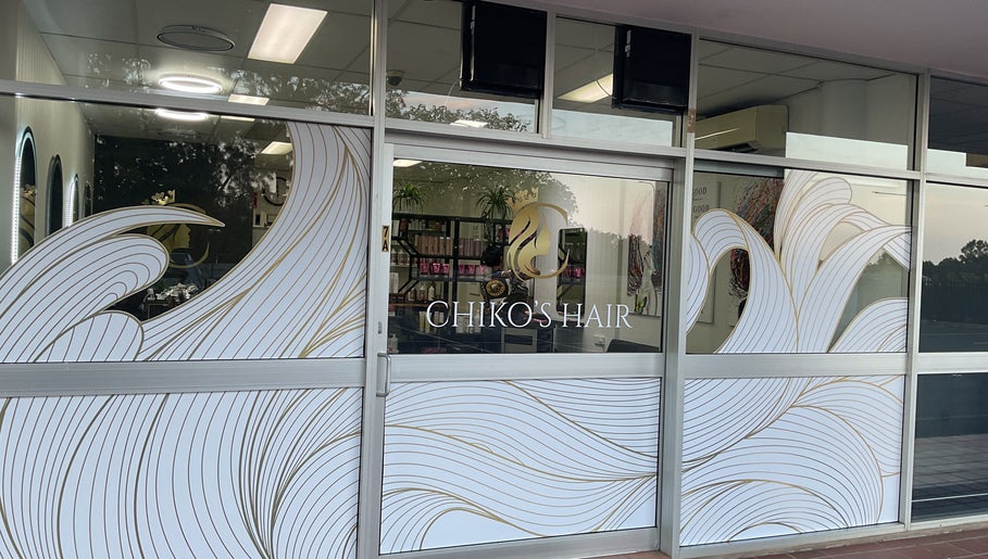 Front view of Chiko's Hair and Beauty Salon in Smithfield, Queensland, AU with stylish window design.