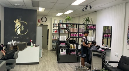 Chiko's Hair and Beauty Salon in Smithfield, Queensland, AU showcasing a stylist at work in a modern setup.