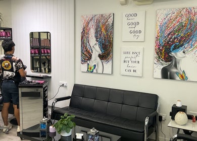 Interior of Chiko's Hair and Beauty Salon, Smithfield, Queensland, AU, featuring modern art and styling station.