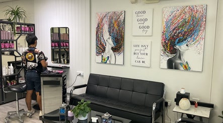 Interior of Chiko's Hair and Beauty Salon, Smithfield, Queensland, AU, featuring modern art and styling station.