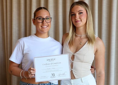 Two smiling women holding a certificate at Pure Beauty, Baxter, Victoria, AU.