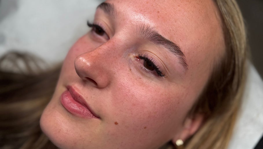 Close-up of woman's face with styled lashes at The Lash Lounge, Fakenham, England, GB.