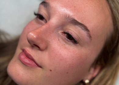 Close-up of woman's face with styled lashes at The Lash Lounge, Fakenham, England, GB.
