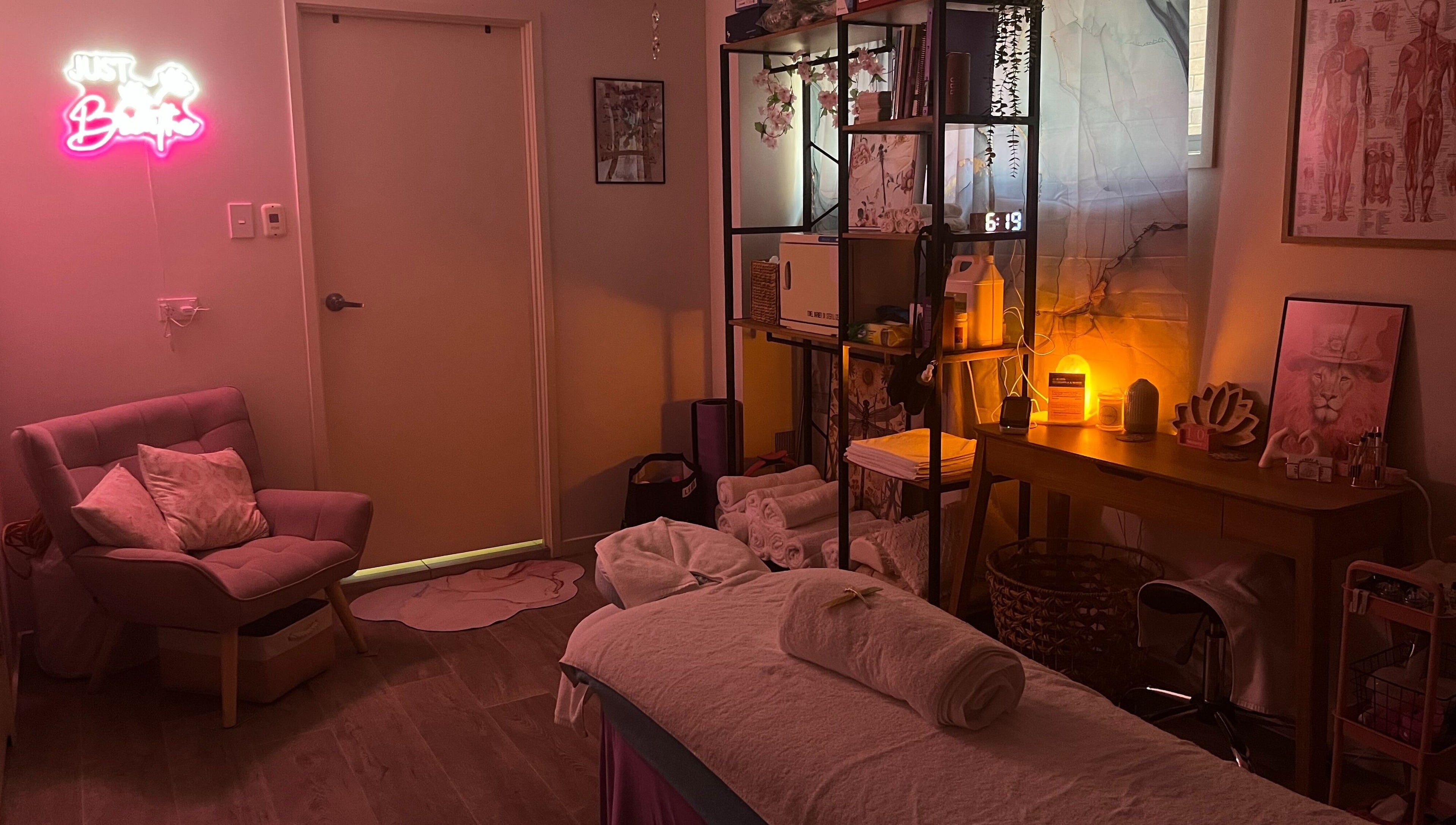 Calm massage room at JRT Remedial Massages, Qld, 4118, AU with cozy chair, soft lighting, and decor.