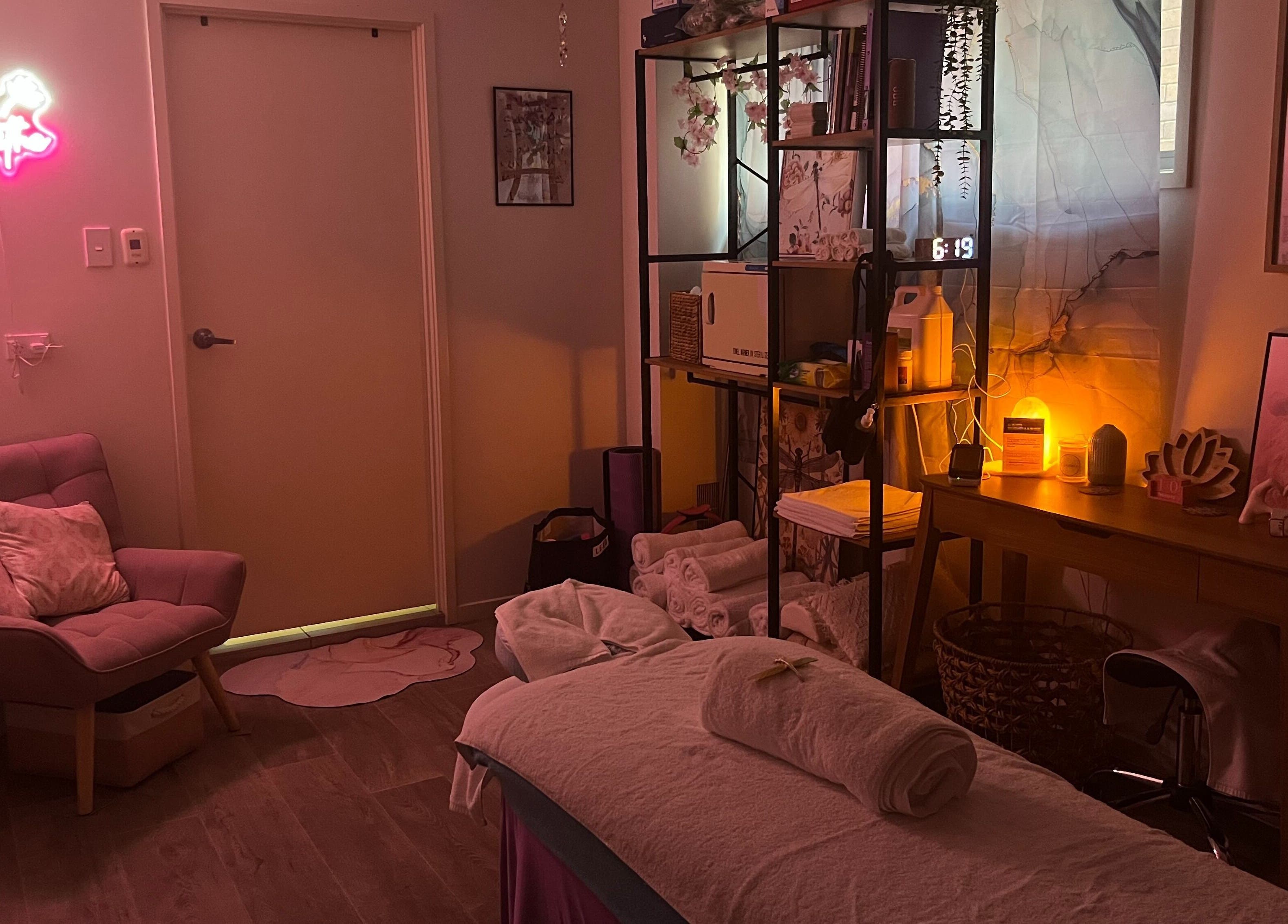 Calm massage room at JRT Remedial Massages, Qld, 4118, AU with cozy chair, soft lighting, and decor.