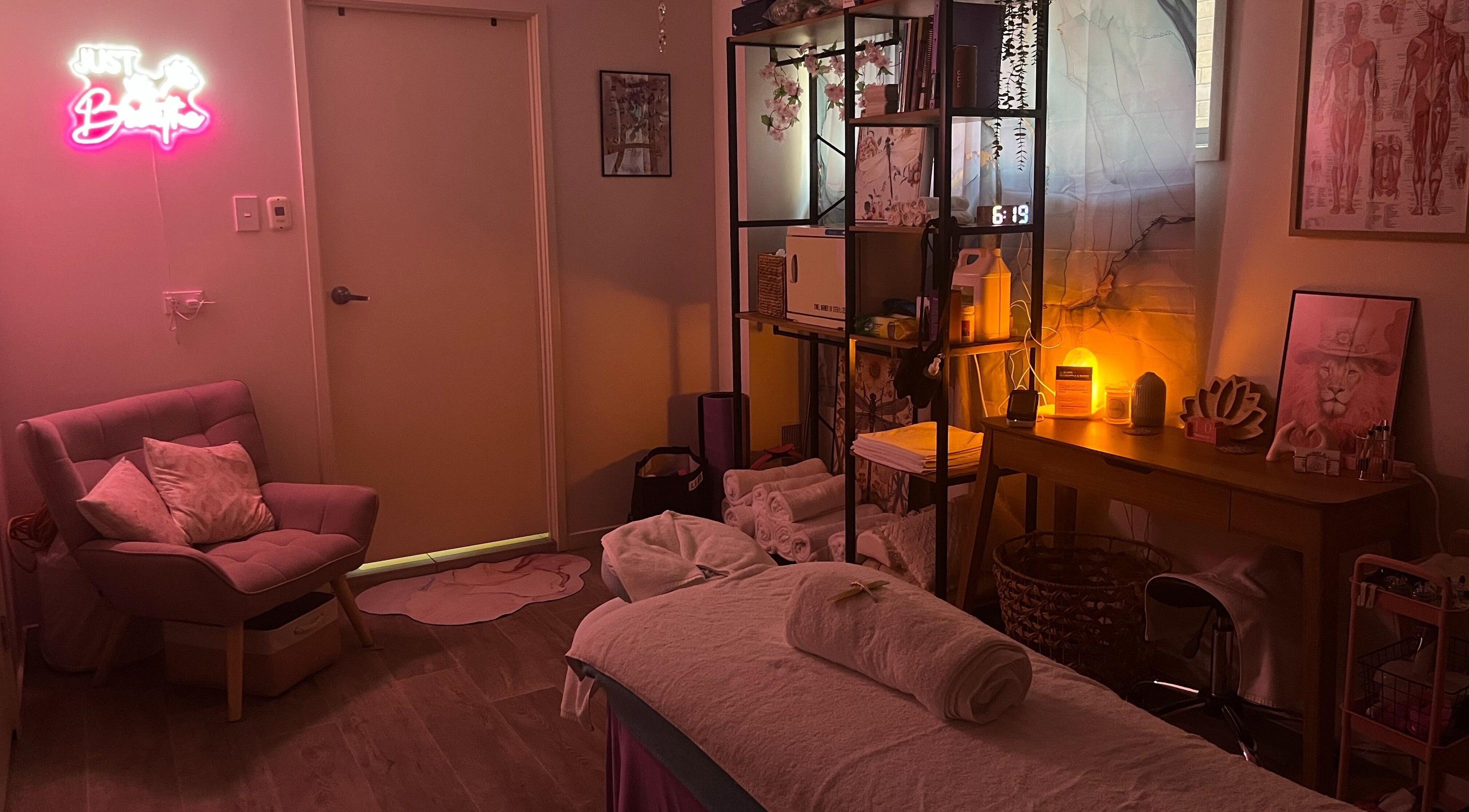 Calm massage room at JRT Remedial Massages, Qld, 4118, AU with cozy chair, soft lighting, and decor.