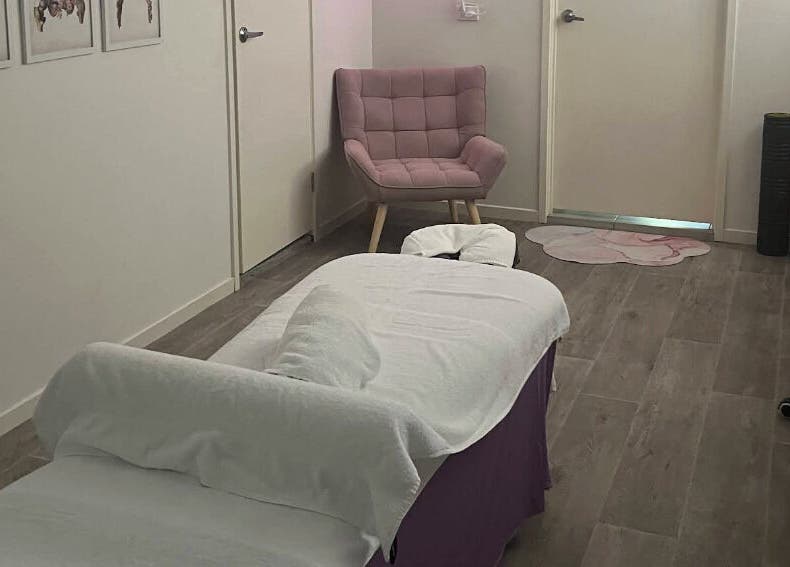 Relaxing massage room at JRT Remedial Massages, Qld, 4118, AU, featuring a cozy chair and a massage table.