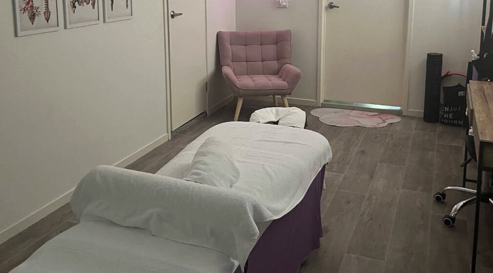 Relaxing massage room at JRT Remedial Massages, Qld, 4118, AU, featuring a cozy chair and a massage table.