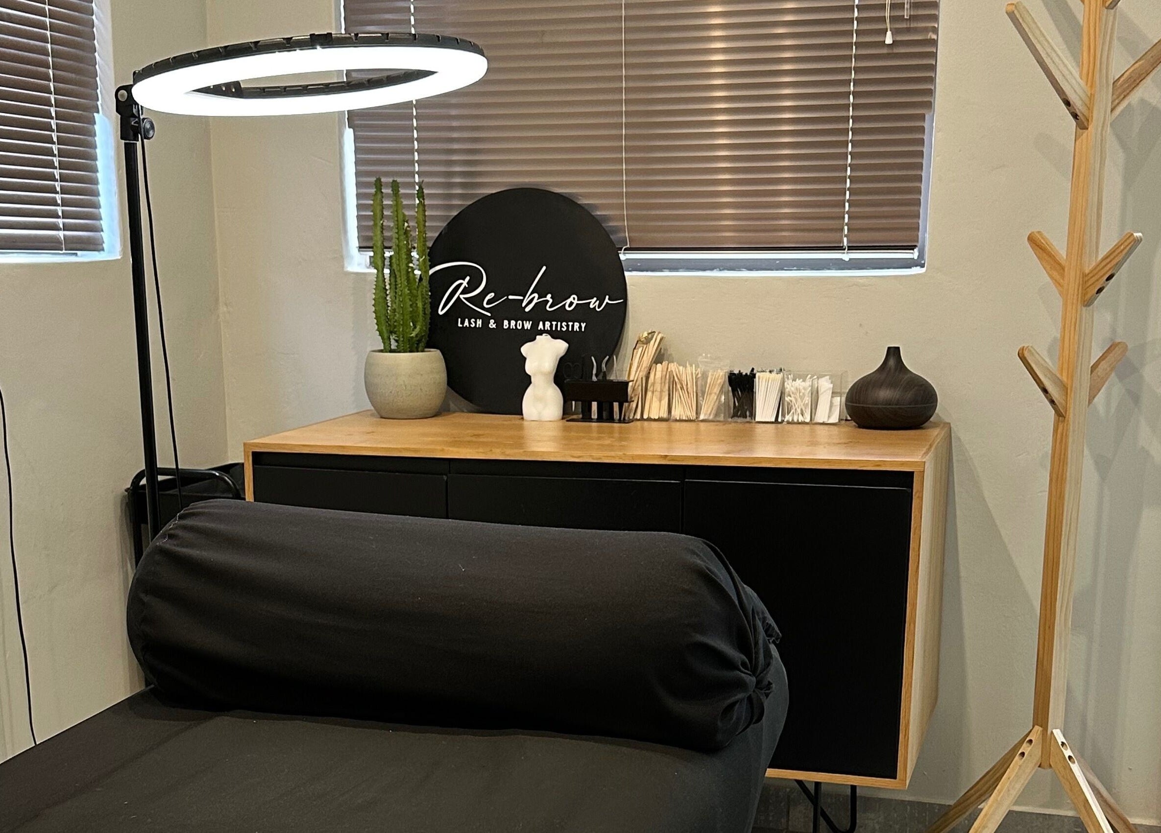 Peaceful corner inside Re Brow Lash & Brow Artistry, Cape Town, Western Cape, ZA with a treatment bed.