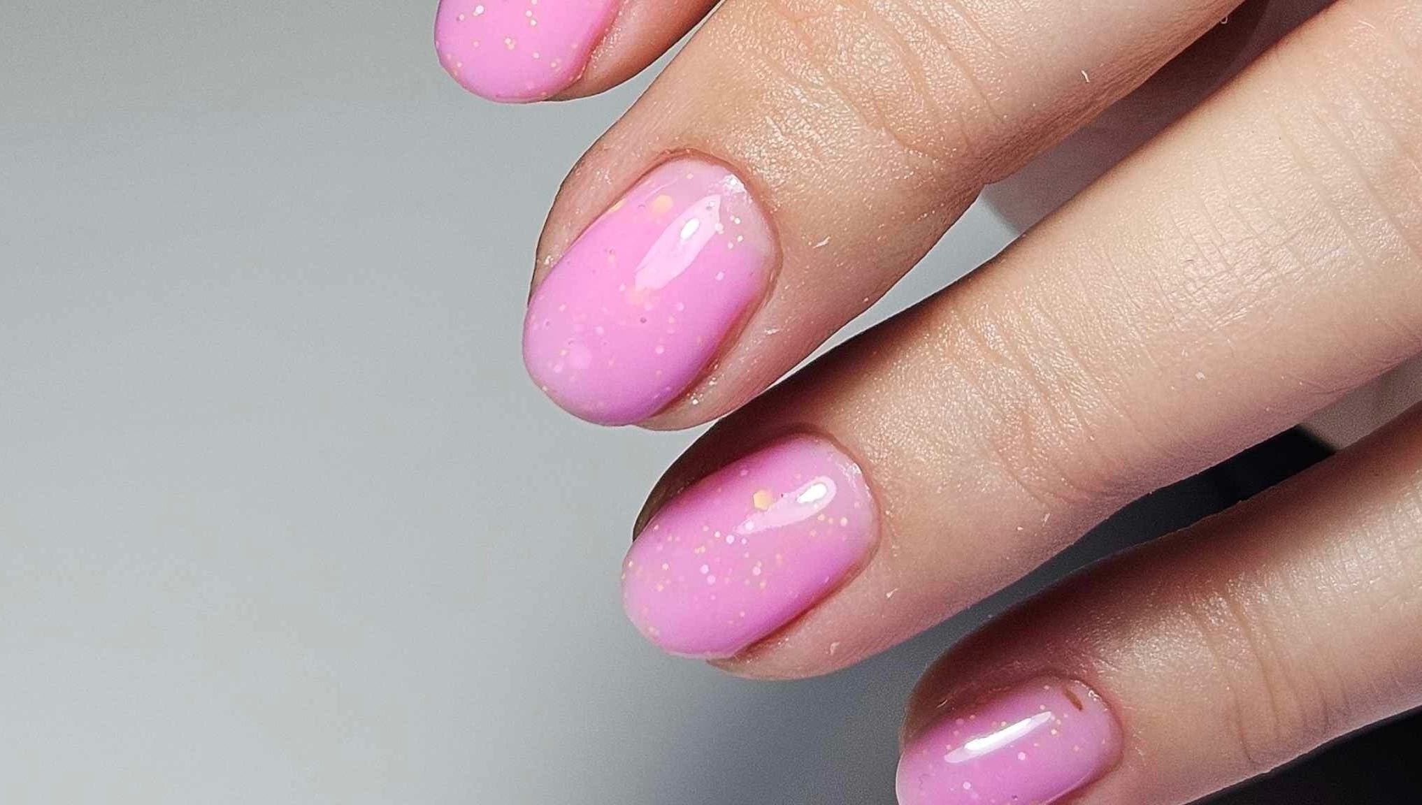 Close-up of sparkling pink nails at The Beauty Lounge by M, Dublin, County Dublin, IE.
