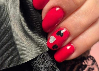 Red manicure with heart design at The Beauty Lounge by M, Dublin, County Dublin, IE.