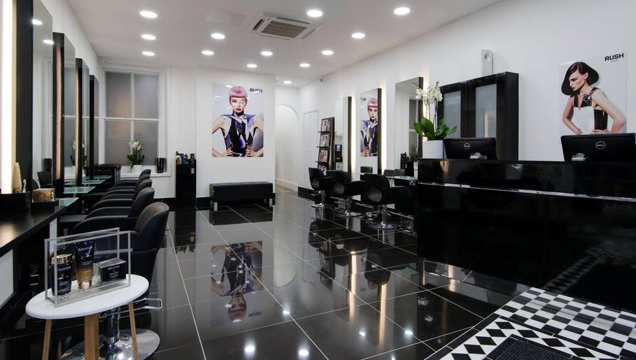 Modern interior of Ella's Beauty salon in London, England, GB with sleek black furniture and stylish decor.