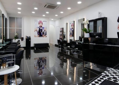 Modern interior of Ella's Beauty salon in London, England, GB with sleek black furniture and stylish decor.