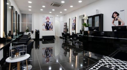 Modern interior of Ella's Beauty salon in London, England, GB with sleek black furniture and stylish decor.