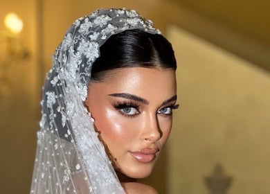 Bridal makeup at Ella’s Beauty in London, England, GB. Showcasing a flawless, radiant look with intricate veil detail.