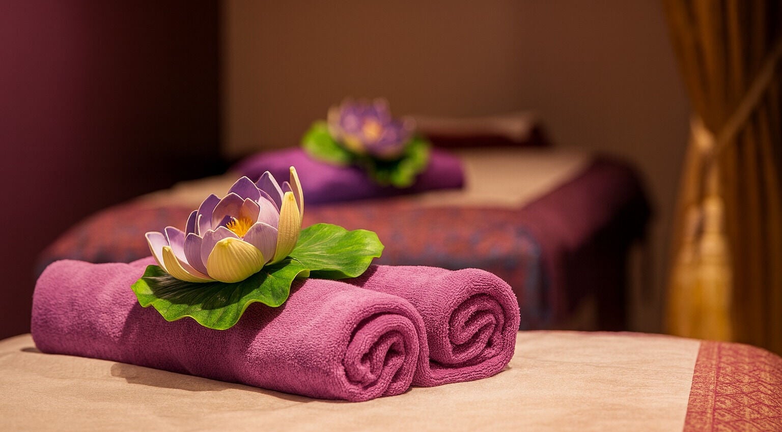 Purple towels and lotus flower at Pailin Thai Wellness, South Yarra, Victoria, AU.