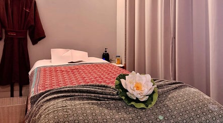 Tranquil massage room at Pailin Thai Wellness in South Yarra, Victoria, AU, featuring elegant decor and soft lighting.