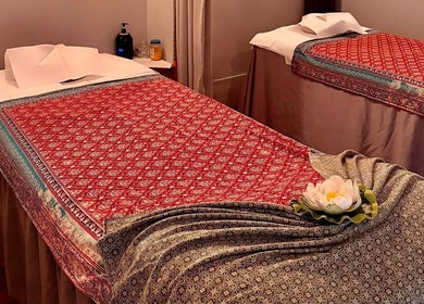 Tranquil massage tables with floral accents at Pailin Thai Wellness, South Yarra, Victoria, AU.