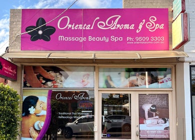 Entrance of Oriental Aroma Thai Massage in Malvern East, Victoria, AU with pink signage and massage imagery.
